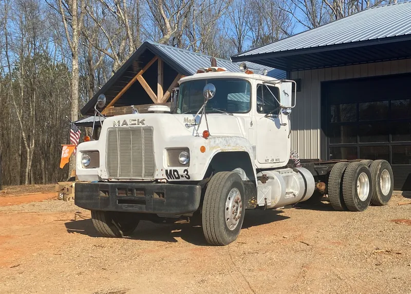 1988 Mack R688ST parked in front of the barn after the drive home